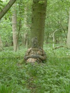 The Badger Watching Man in full camouflage clothing